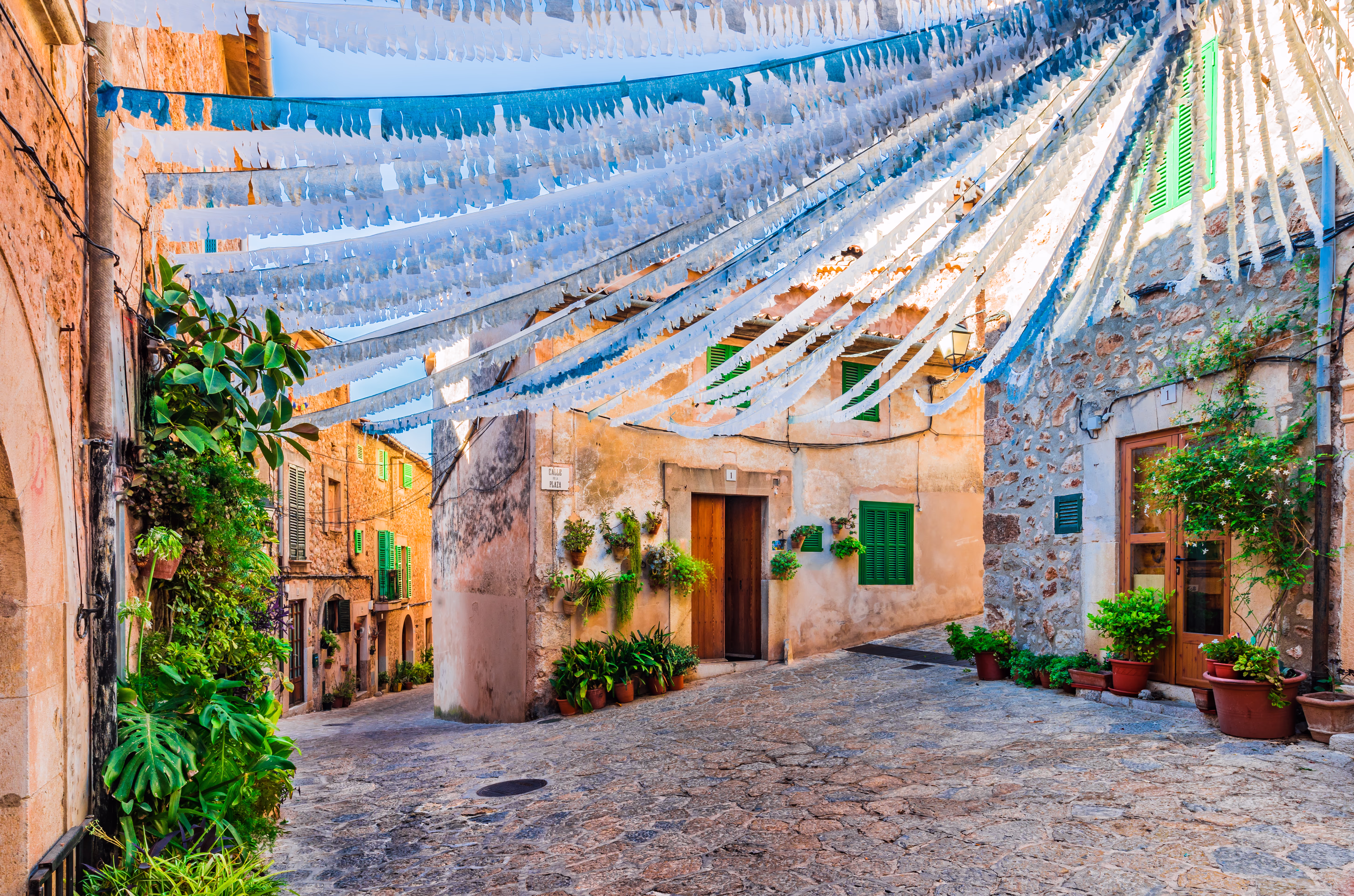 Decorated street in an alley with old houses in Valldemossa Decorated street in an alley with old houses in Valldemossa