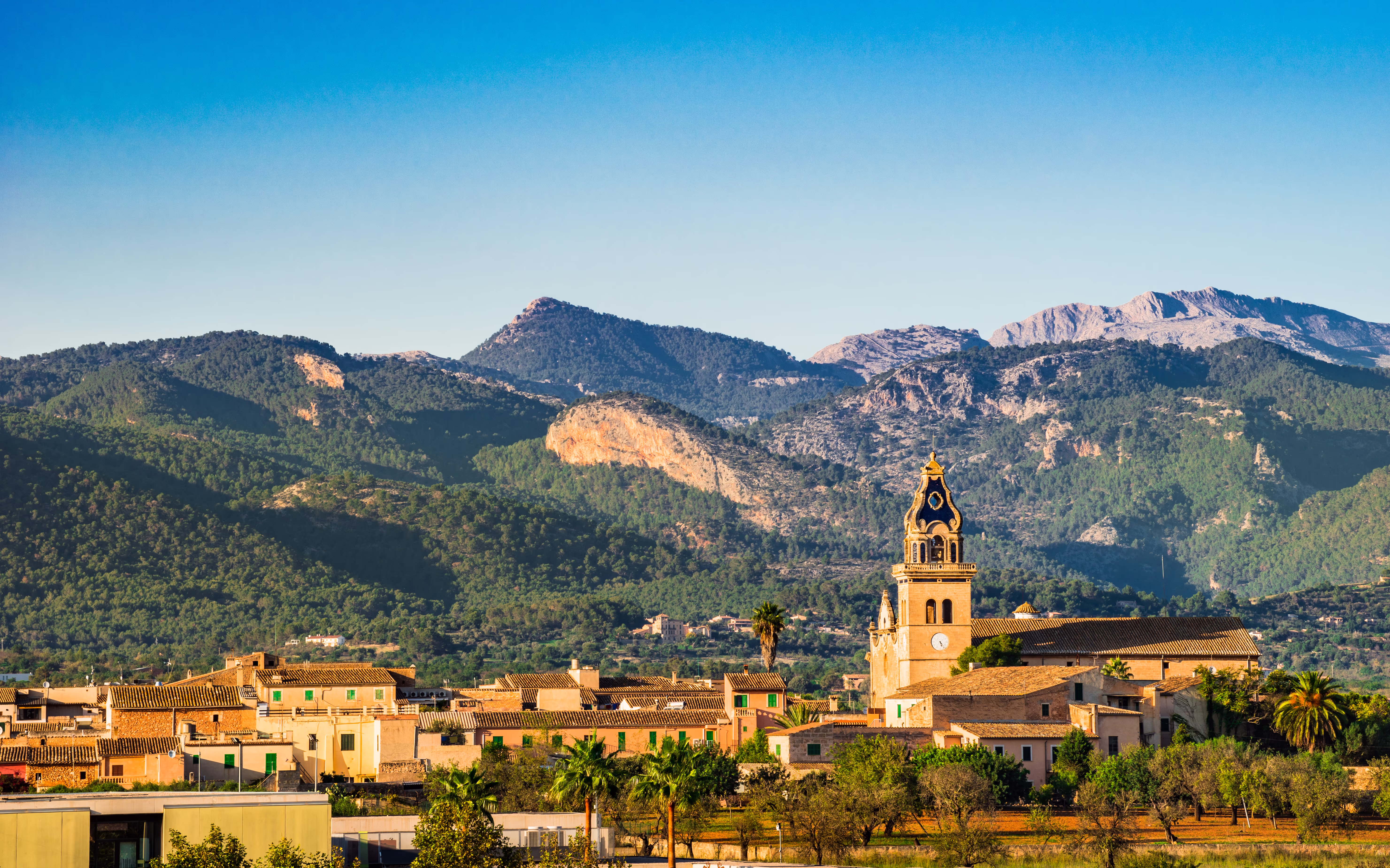 View of Santa Maria del Cami at the foot of the Tramuntana Mountains View of Santa Maria del Cami at the foot of the Tramuntana Mountains